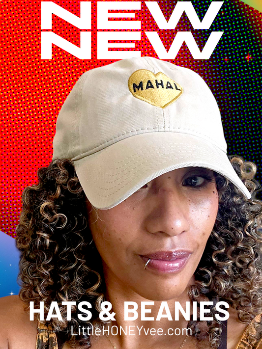 Person wearing a beige cap with 'MAHAL' in a heart on a colorful background, promoting 'HATS & BEANIES' by LittleHONEYvee.com.